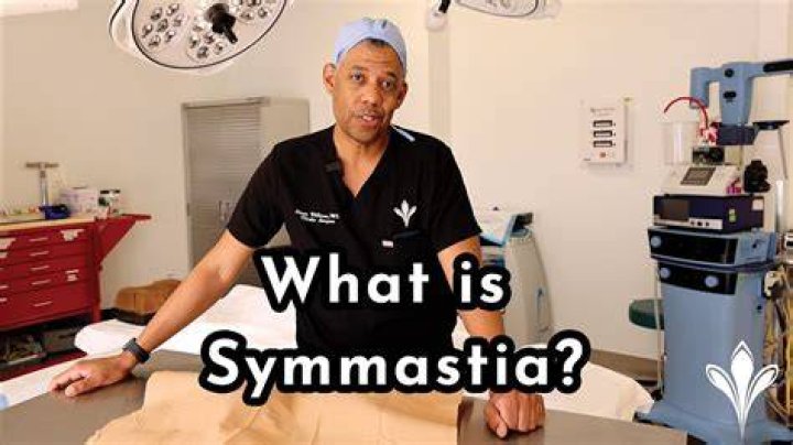 What causes symmastia